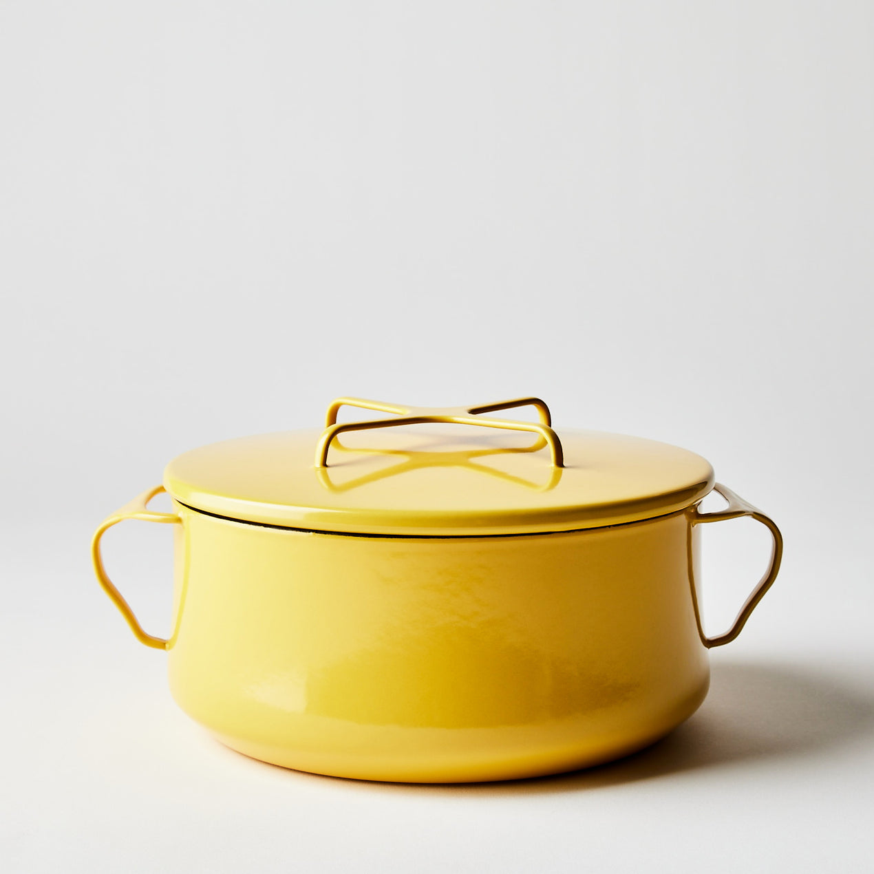 https://www.dansk.com/cdn/shop/products/2022-0308_dansk_kobenstyle-casserole-with-lid_yellow-4-qt_silo_ty-mecham_1270x.jpg?v=1654830886